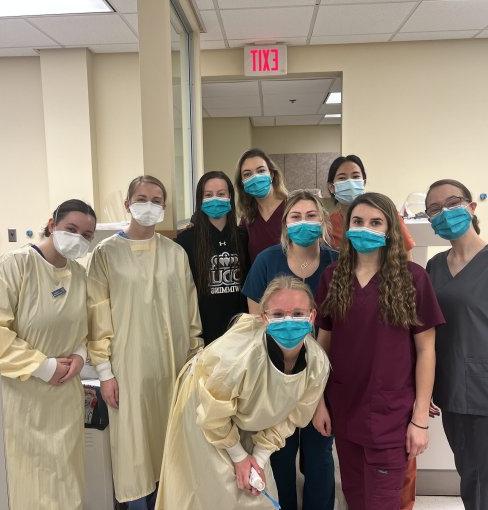 group of dental hygiene students posing for a photo 